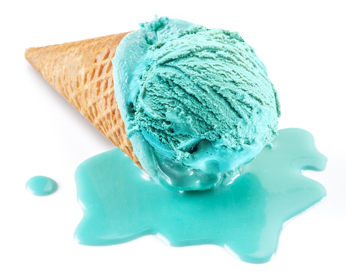 Blue melted ice cream in waffle cone on white background. Melt ice cream puddle near cone with ice.